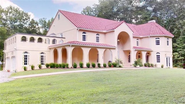a front view of multiple houses with yard