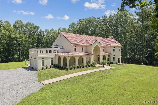 a front view of a house with a yard table and chairs