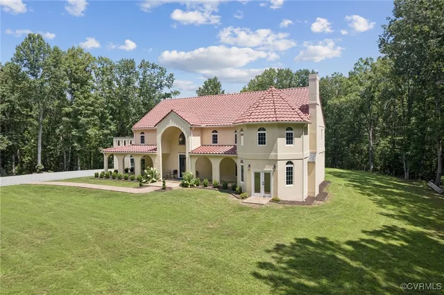 a view of a house with a yard porch and sitting area
