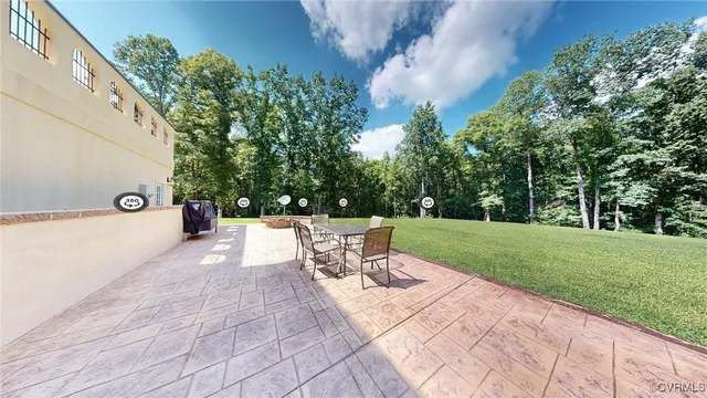 a view of backyard with seating space