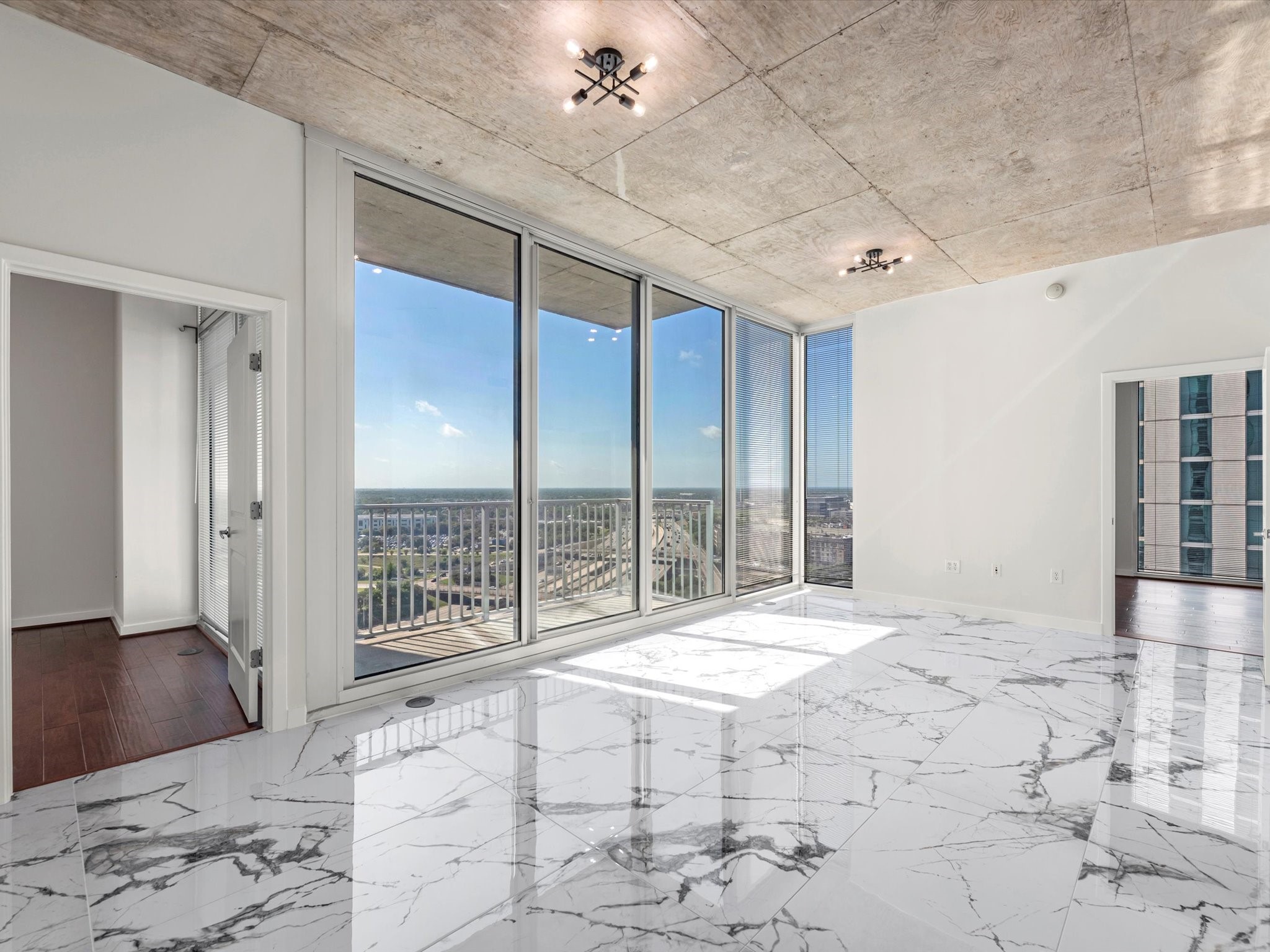 5925 Almeda Road, Unit 11702 Houston, TX 77004 - Photo 2 of 35 a large bedroom with a large bed and a large window