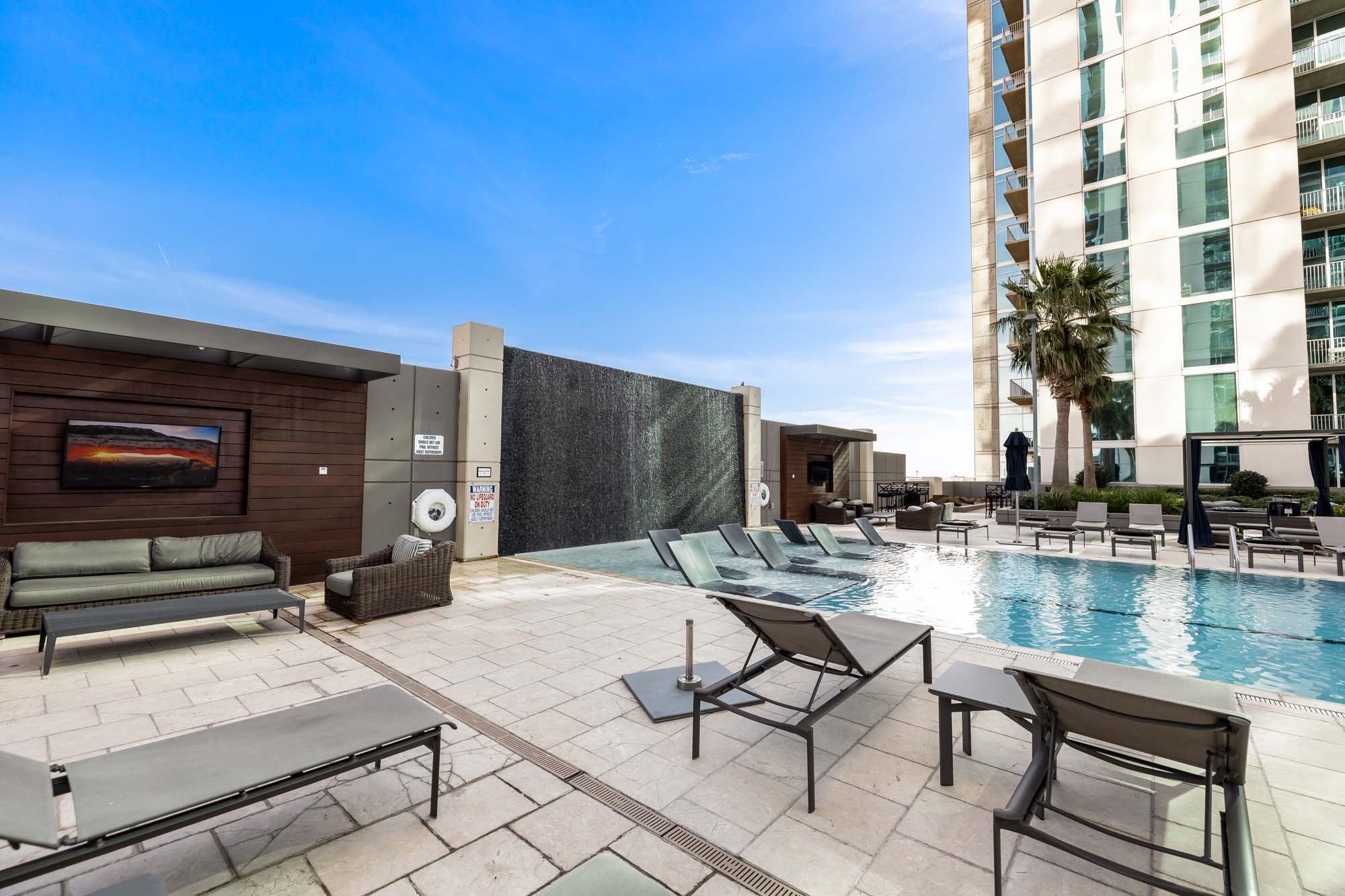 5925 Almeda Road, Unit 11702 Houston, TX 77004 - Photo 26 of 35 a swimming pool with outdoor seating and yard