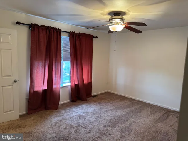a view of a room with window and stairs