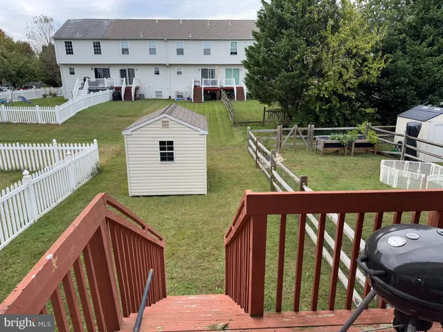 a view of a chair and table in the balcony