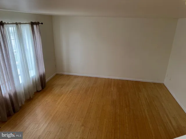 a view of wooden floor and staircase in a room