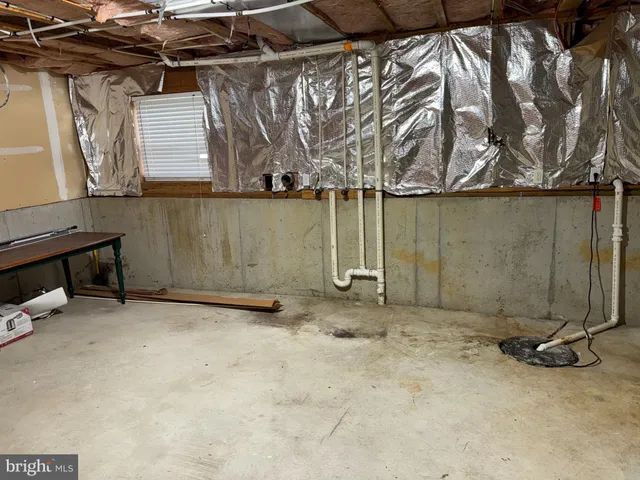 a view of a room with wooden walls