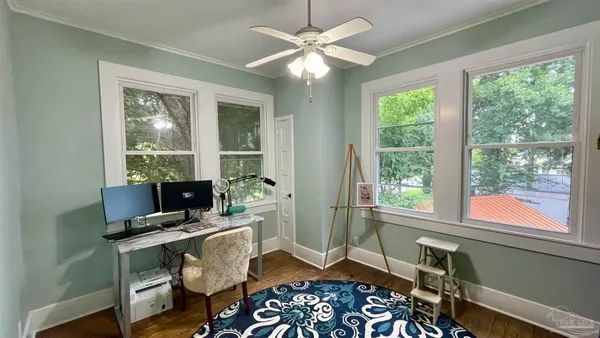 a workspace with furniture and a window