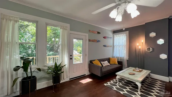 a living room with furniture and a large window