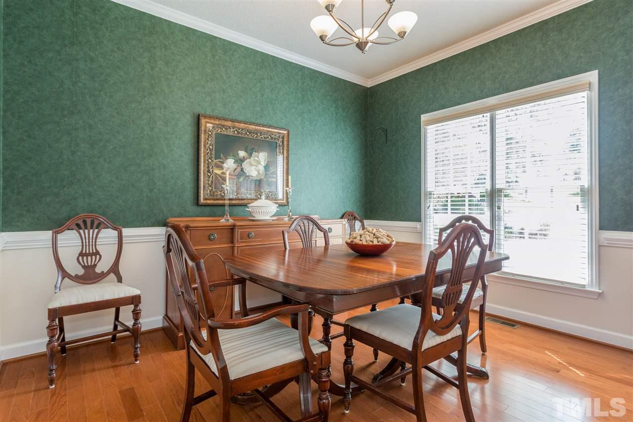 3225 Sandy Bluff Road Raleigh, NC 27616 - Photo 13 of 25 a view of a dining room with furniture window and wooden floor