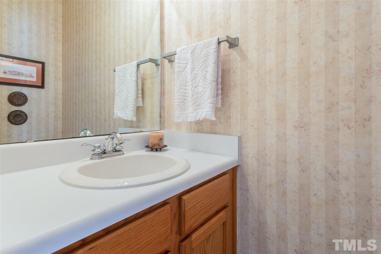 3225 Sandy Bluff Road Raleigh, NC 27616 - Photo 15 of 25 a bathroom with a sink and a mirror