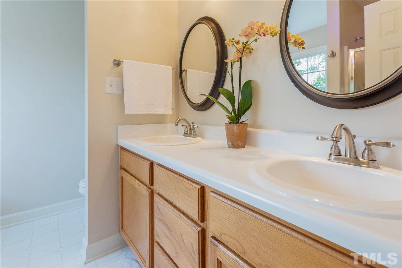 3225 Sandy Bluff Road Raleigh, NC 27616 - Photo 19 of 25 a bathroom with a sink and a mirror