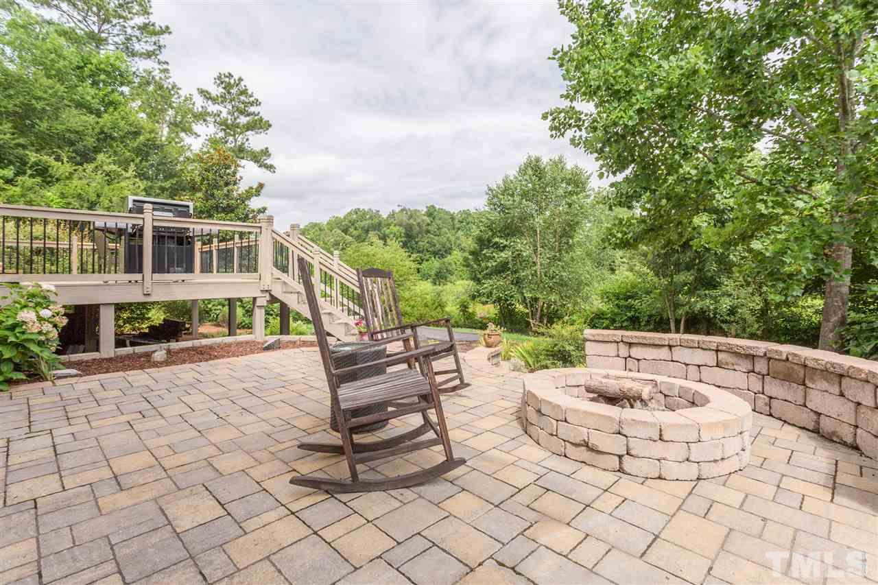 3225 Sandy Bluff Road Raleigh, NC 27616 - Photo 3 of 25 a view of a patio with a table and chairs
