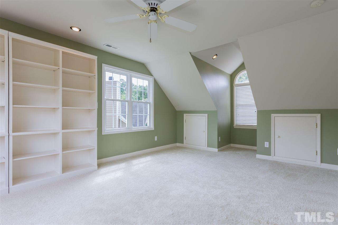 3225 Sandy Bluff Road Raleigh, NC 27616 - Photo 21 of 25 a view of an empty room with a window and a kitchen