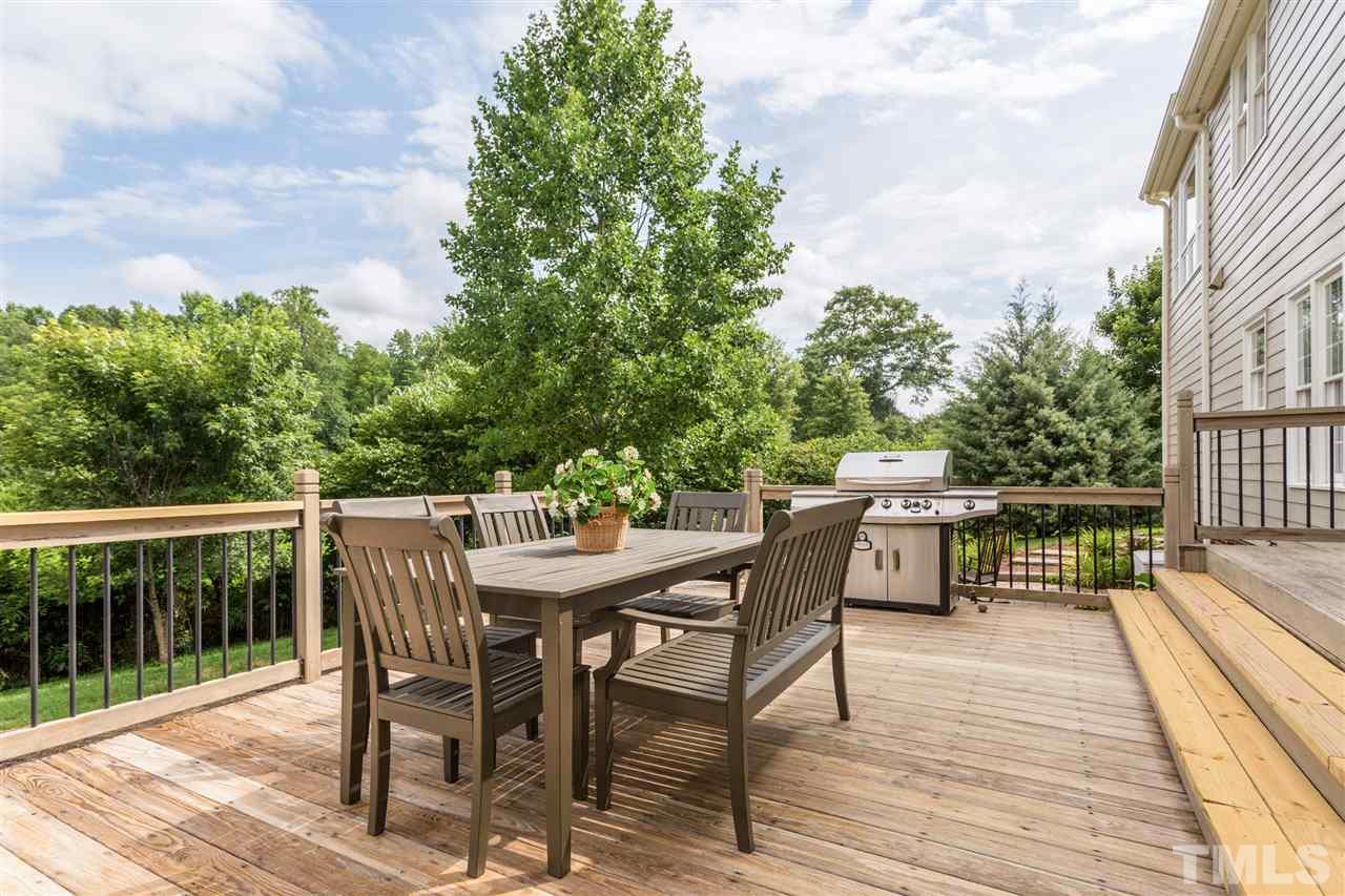 3225 Sandy Bluff Road Raleigh, NC 27616 - Photo 4 of 25 a patio with wooden floor and outdoor seating