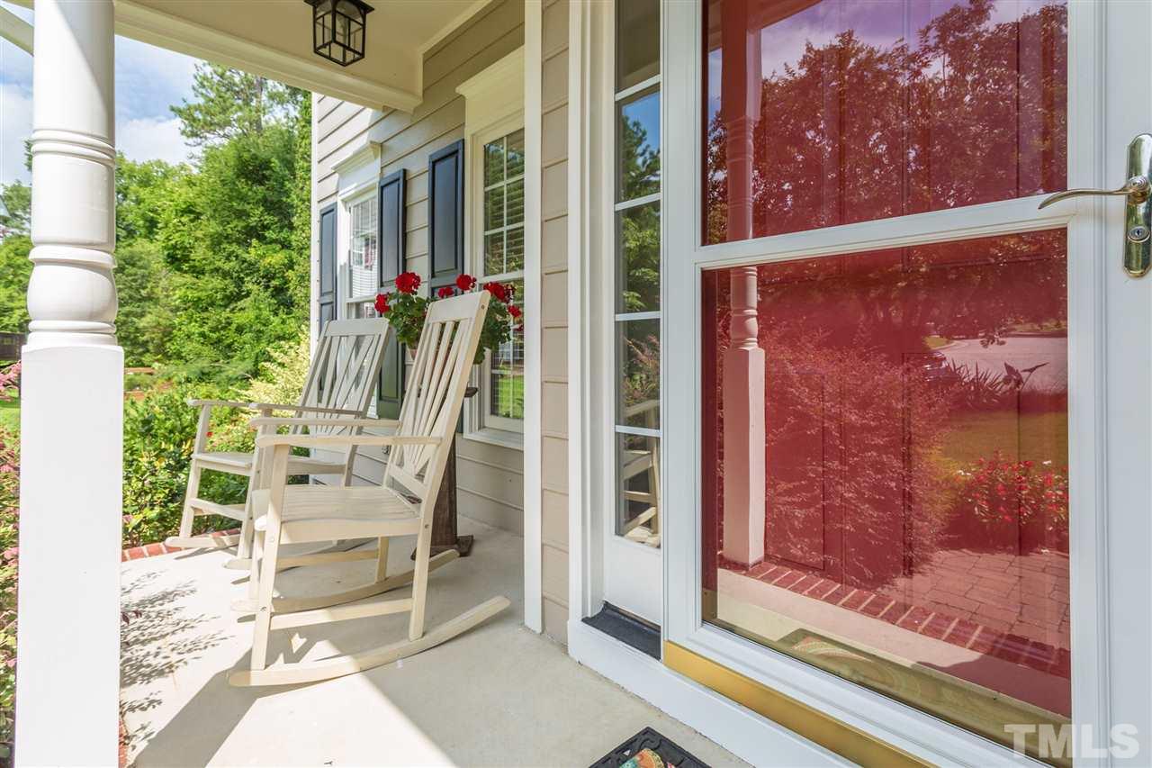 3225 Sandy Bluff Road Raleigh, NC 27616 - Photo 5 of 25 a view of a balcony with table and chairs and potted plants