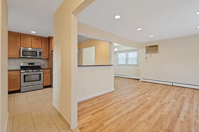 a view of a kitchen with a sink and a stove top oven