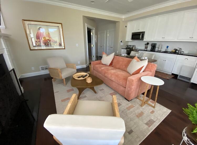 74 Simons Road, Unit B Mashpee, MA 02649 - Photo 1 of 11 a living room with furniture and a flat screen tv