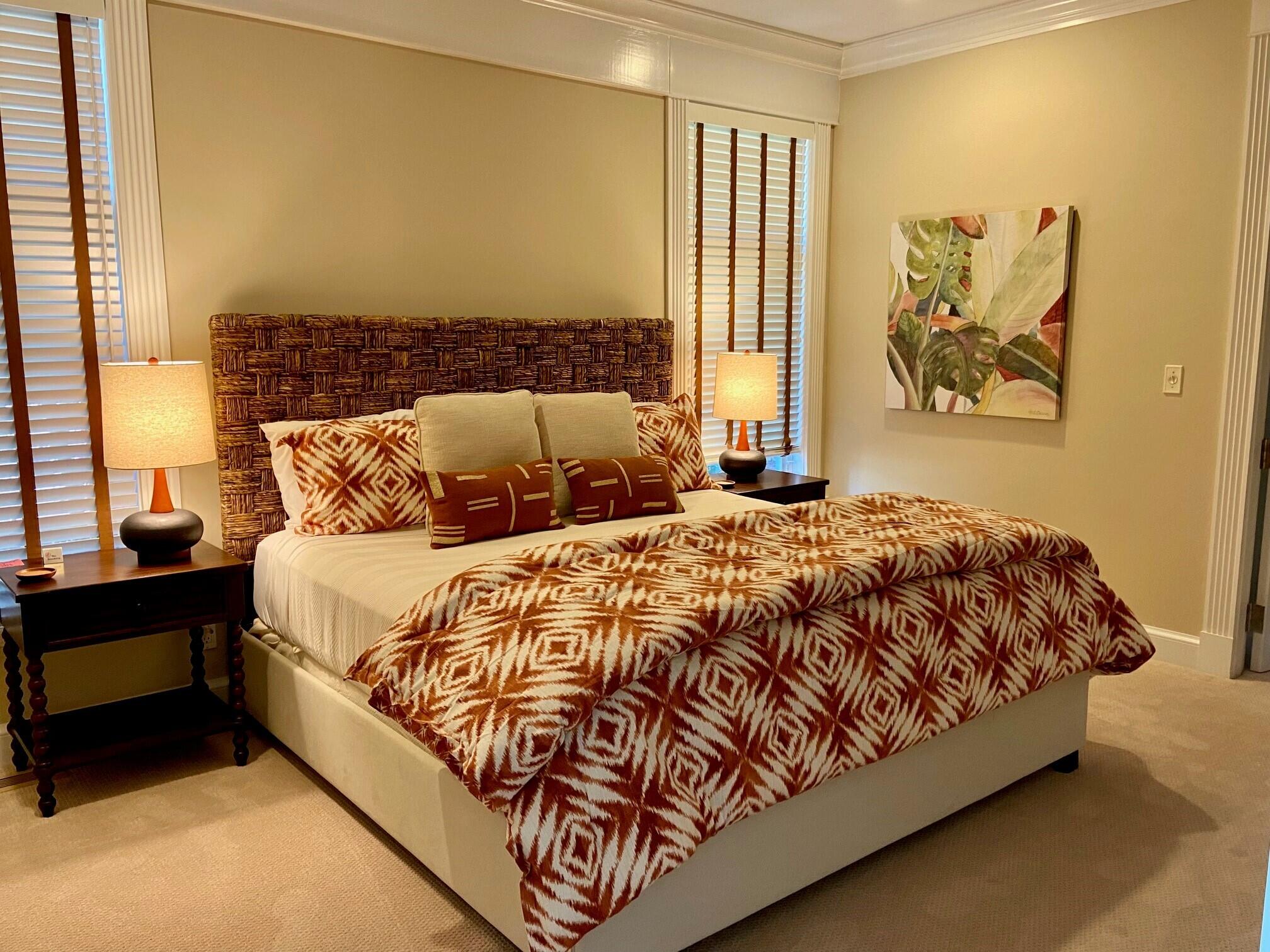 74 Simons Road, Unit B Mashpee, MA 02649 - Photo 3 of 11 a bed sitting in a bedroom next to a window