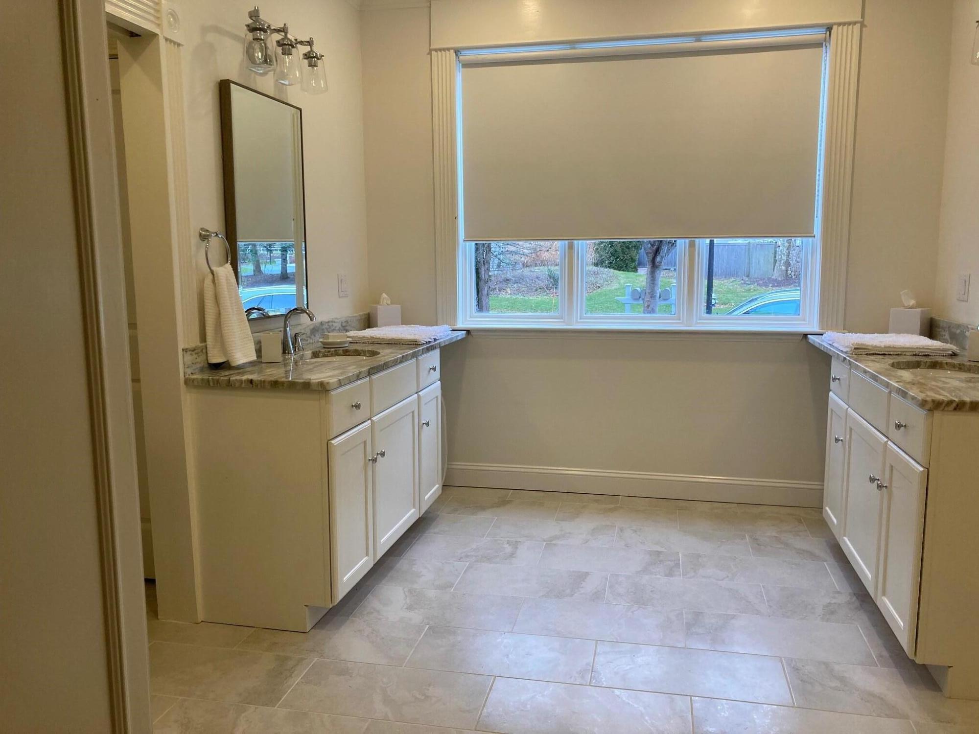 74 Simons Road, Unit B Mashpee, MA 02649 - Photo 4 of 11 a bathroom with a sink a washer and dryer