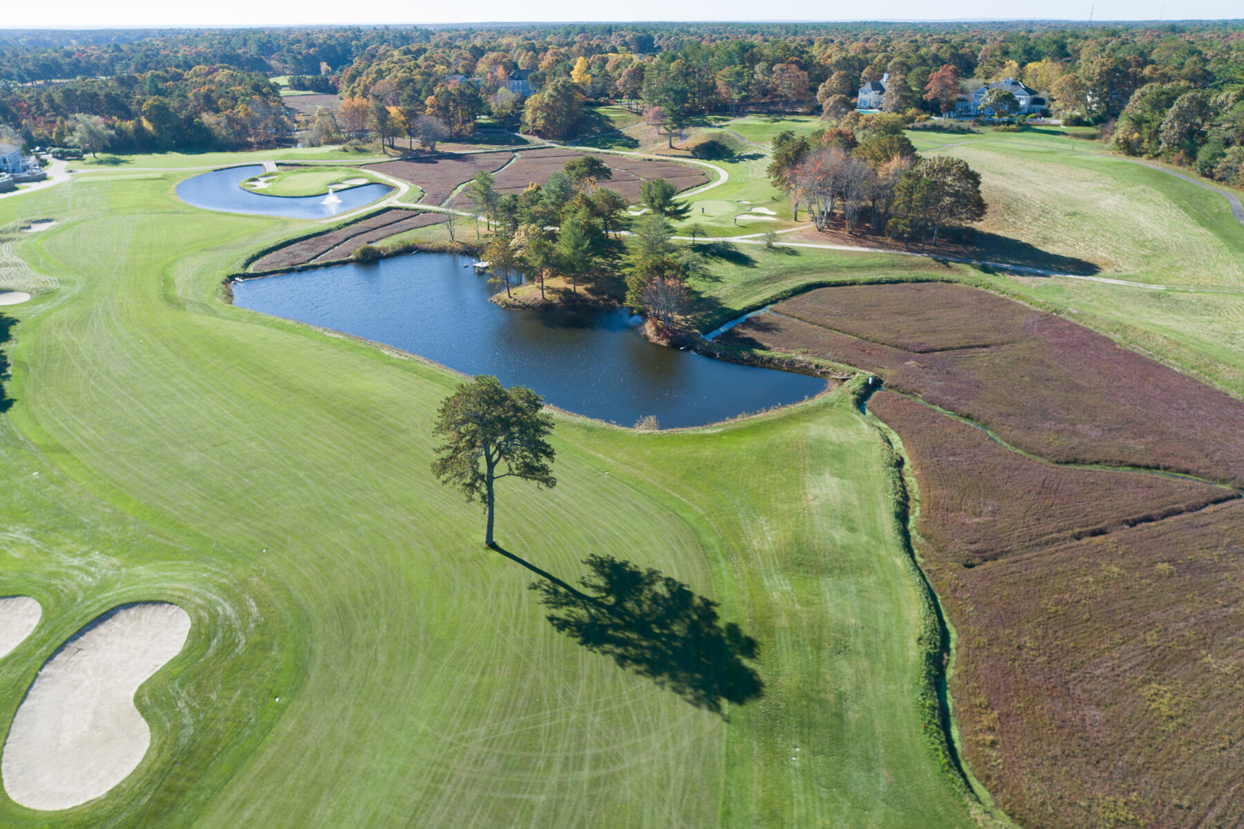 74 Simons Road, Unit B Mashpee, MA 02649 - Photo 9 of 11 a view of a lake with a yard