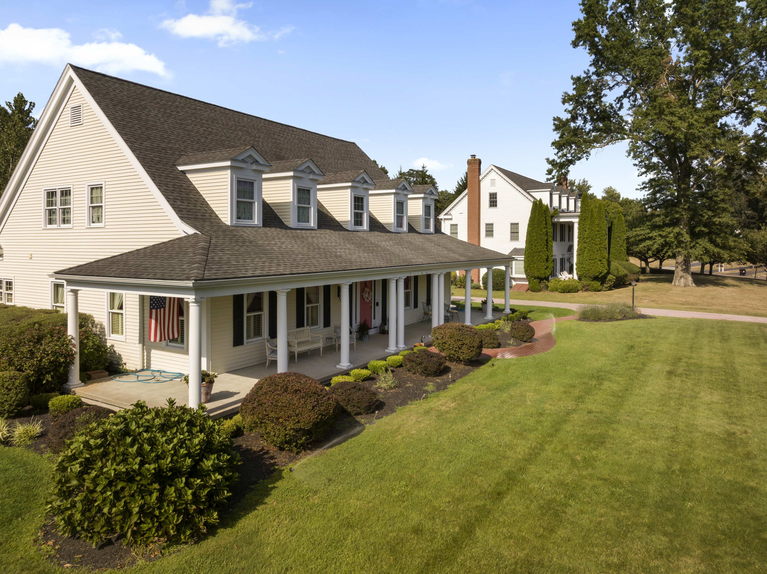 a front view of a house with garden