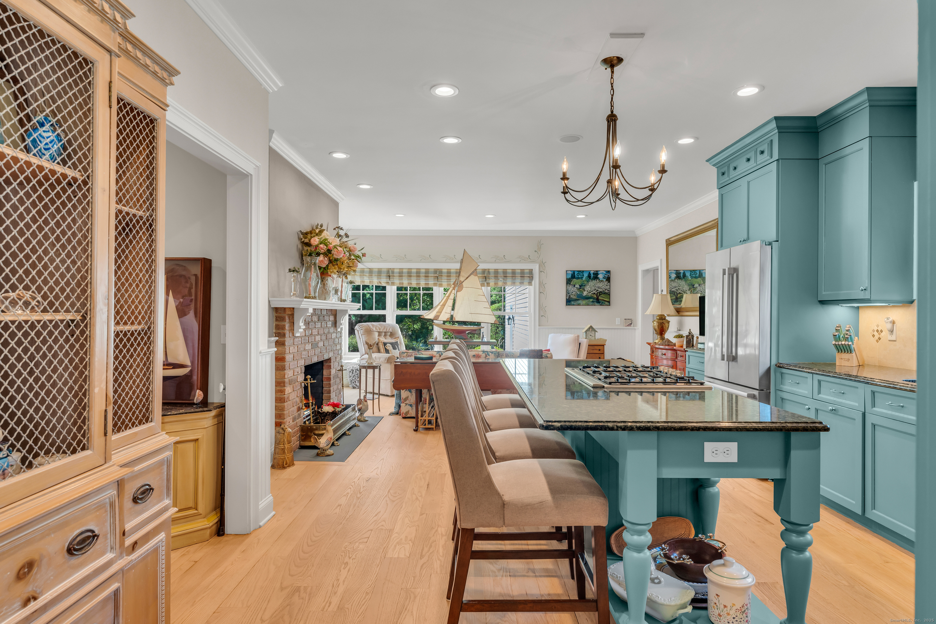 41 Allison Drive Madison, CT 06443 - Photo 12 of 40 a view of a dining room with furniture window and wooden floor
