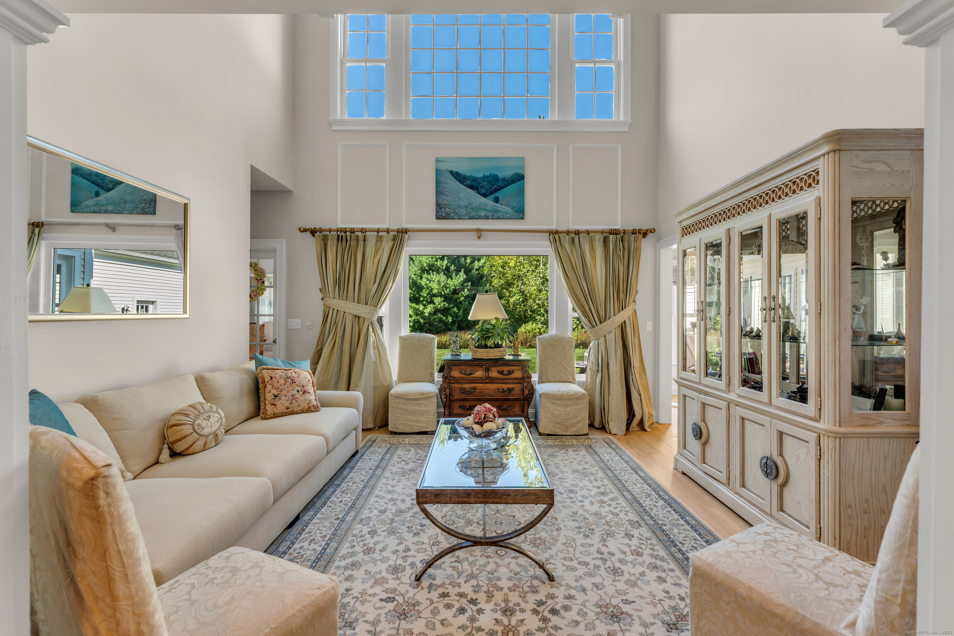 41 Allison Drive Madison, CT 06443 - Photo 7 of 40 a living room with furniture potted plant and a large window