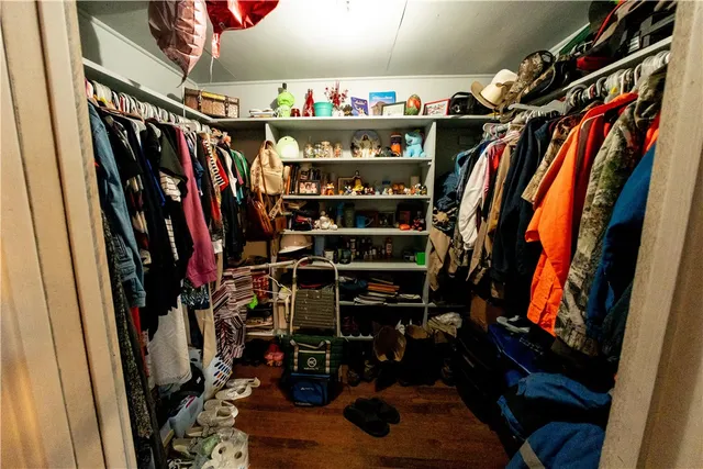 a bathroom with a sink mirror vanity and toilet
