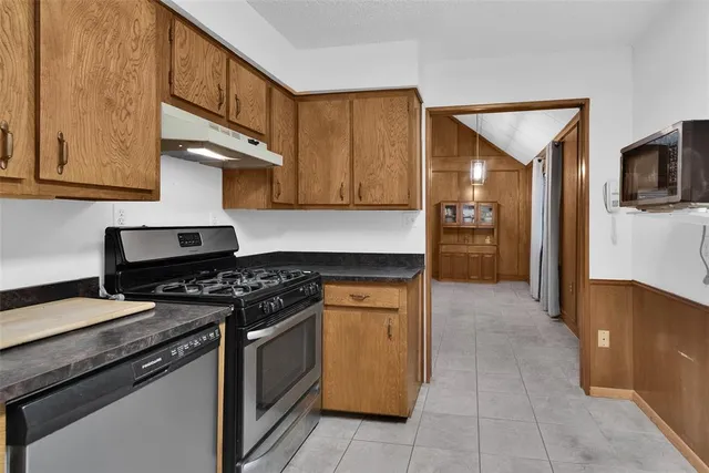a kitchen with a stove and a microwave