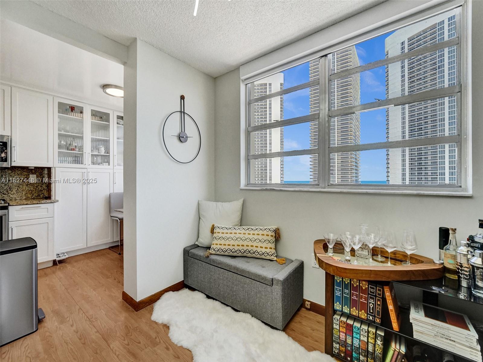 1833 South Ocean Drive, Unit 1702 Hallandale Beach, FL 33009 - Photo 17 of 80 a view of a livingroom with furniture and wooden floor