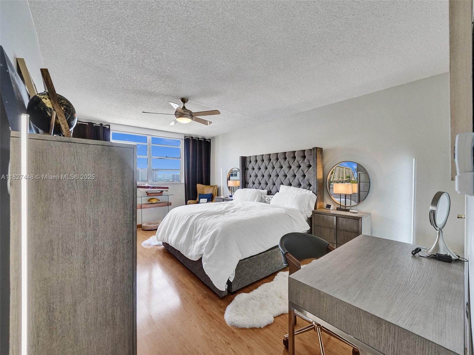 1833 South Ocean Drive, Unit 1702 Hallandale Beach, FL 33009 - Photo 28 of 80 a bedroom with a bed and a table with chair