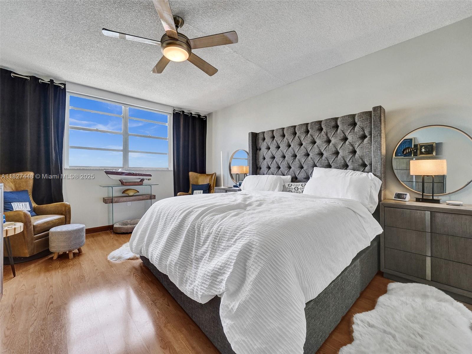 1833 South Ocean Drive, Unit 1702 Hallandale Beach, FL 33009 - Photo 30 of 80 a bedroom with a bed and a chandelier