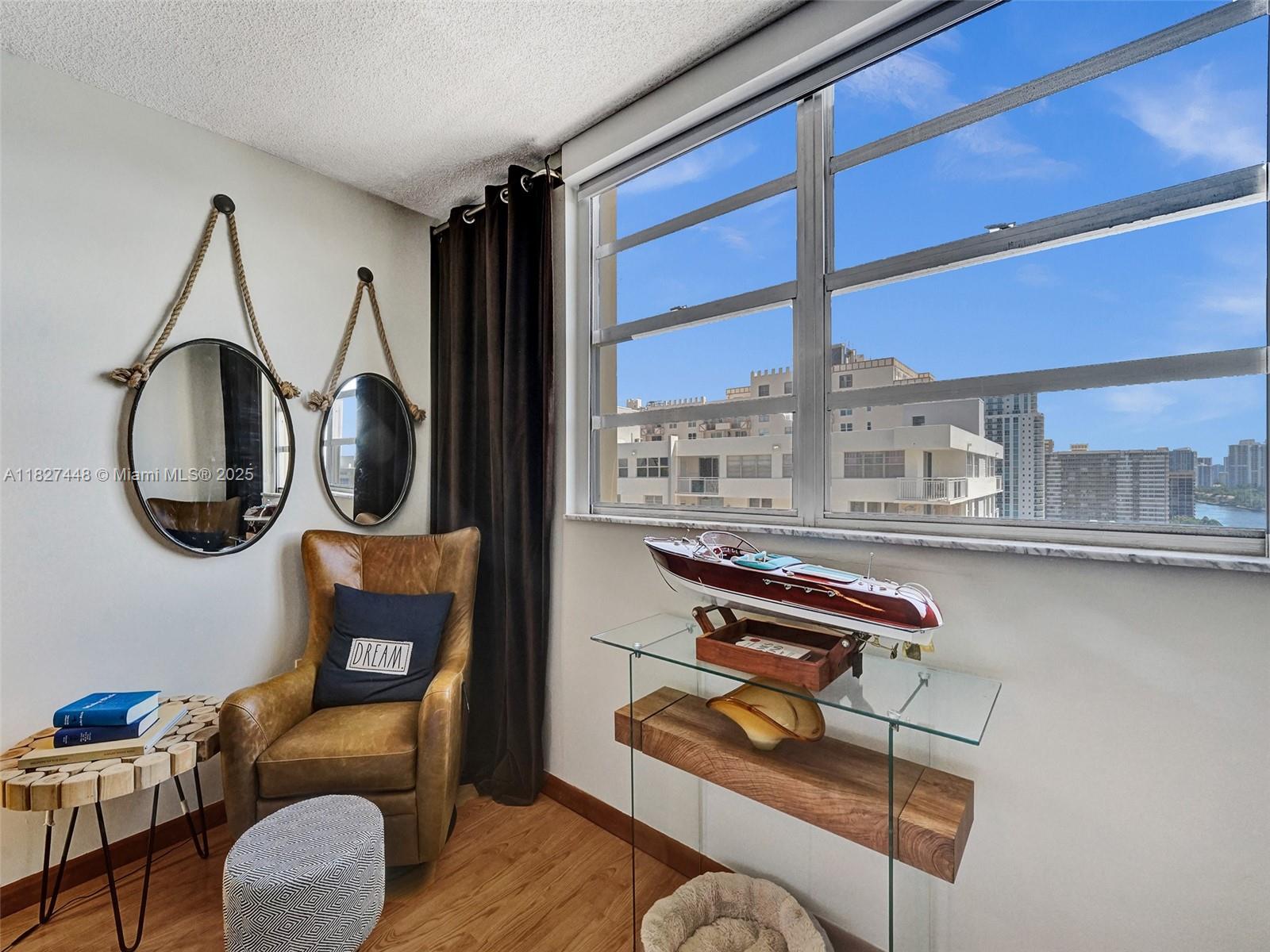 1833 South Ocean Drive, Unit 1702 Hallandale Beach, FL 33009 - Photo 34 of 80 a living room with furniture a rug and a large window