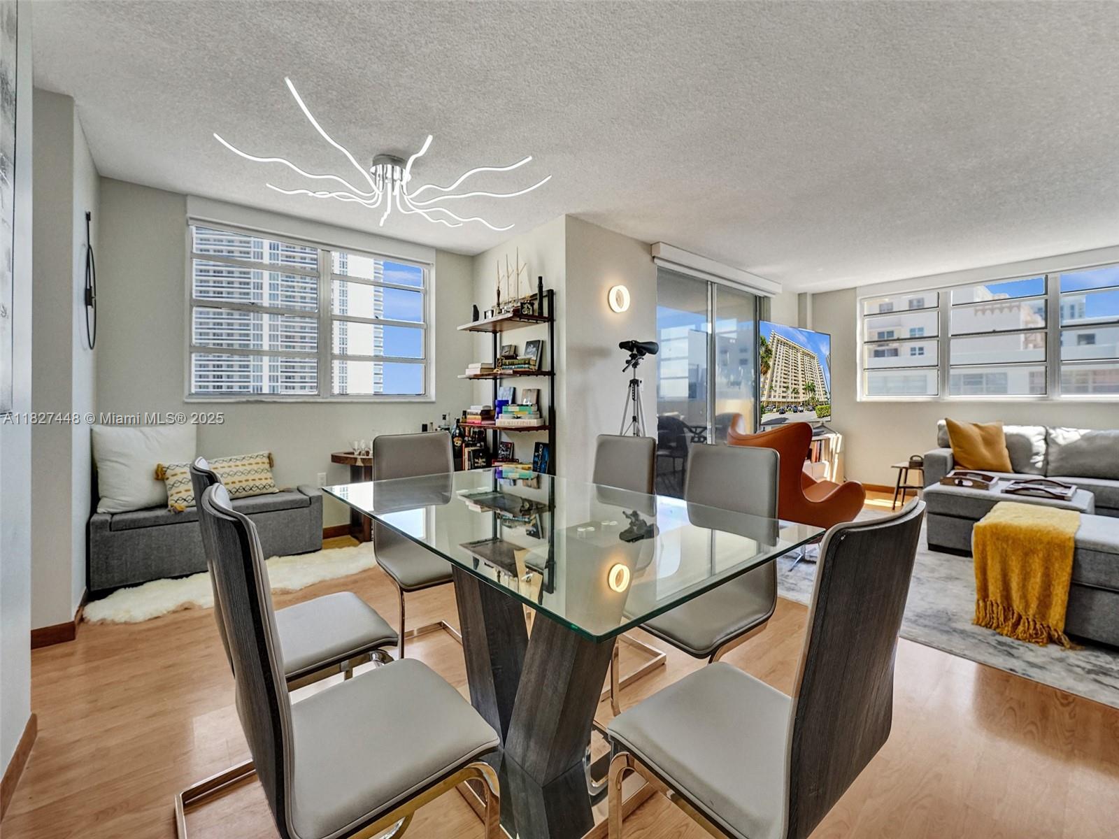 1833 South Ocean Drive, Unit 1702 Hallandale Beach, FL 33009 - Photo 4 of 80 a dining room with furniture and window