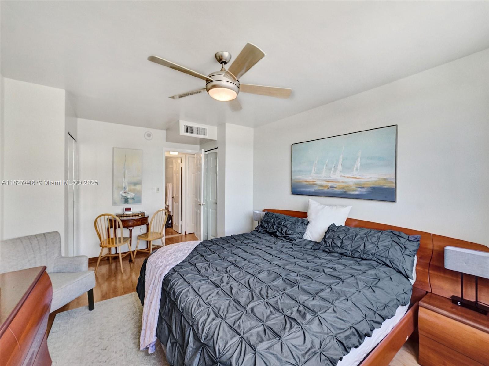 1833 South Ocean Drive, Unit 1702 Hallandale Beach, FL 33009 - Photo 44 of 80 a bedroom with a bed and a chandelier