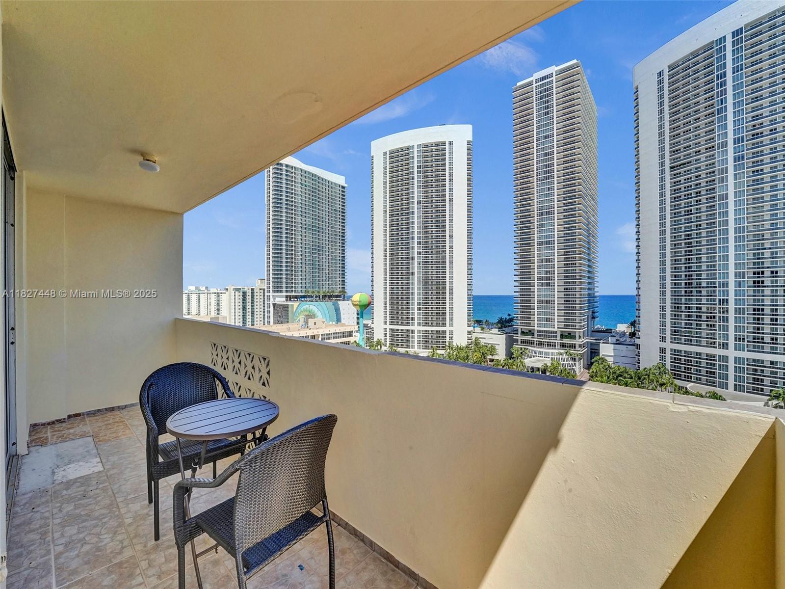 1833 South Ocean Drive, Unit 1702 Hallandale Beach, FL 33009 - Photo 48 of 80 a living room with a couch and a table
