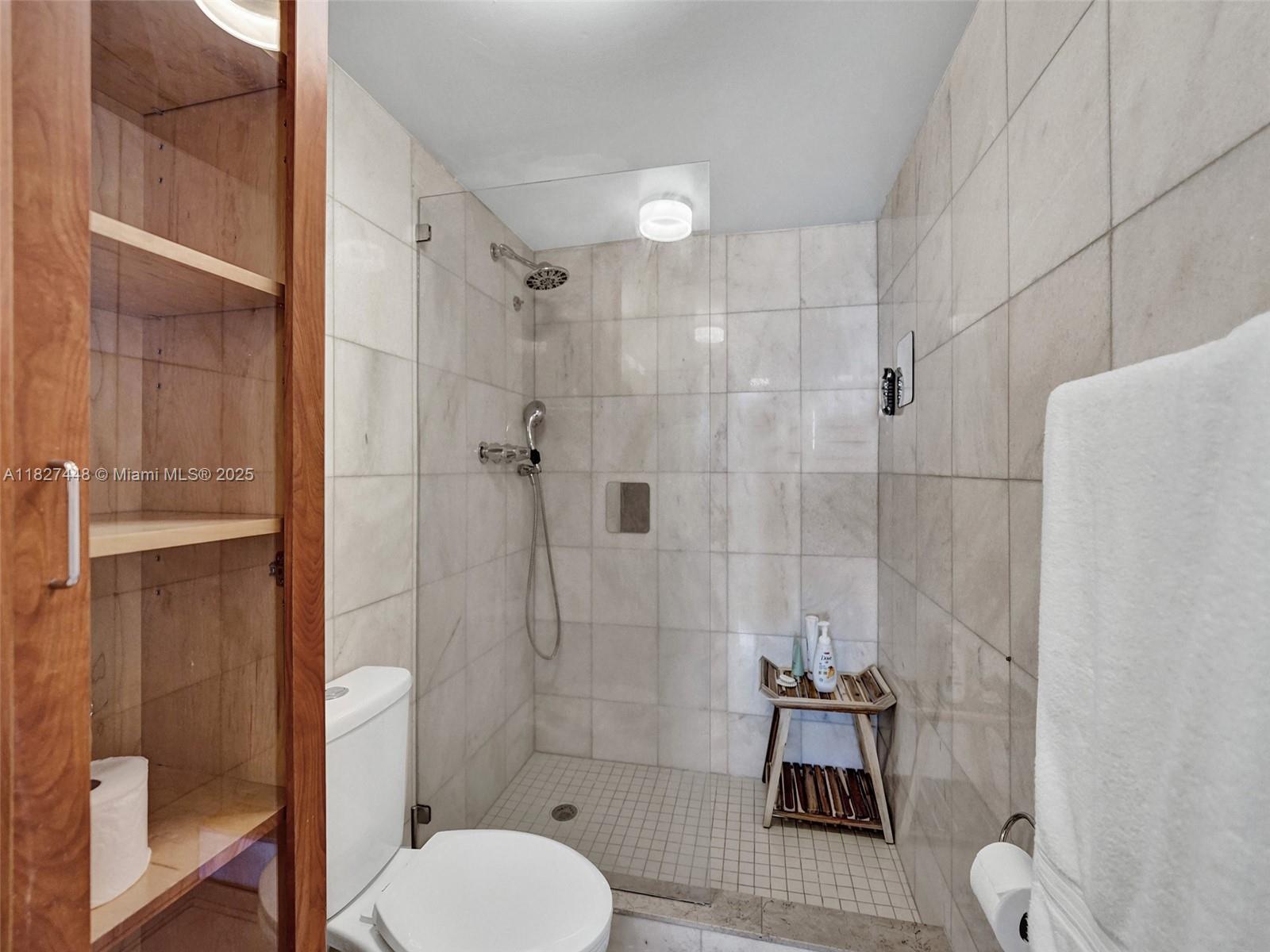 1833 South Ocean Drive, Unit 1702 Hallandale Beach, FL 33009 - Photo 53 of 80 a bathroom with a toilet and a shower