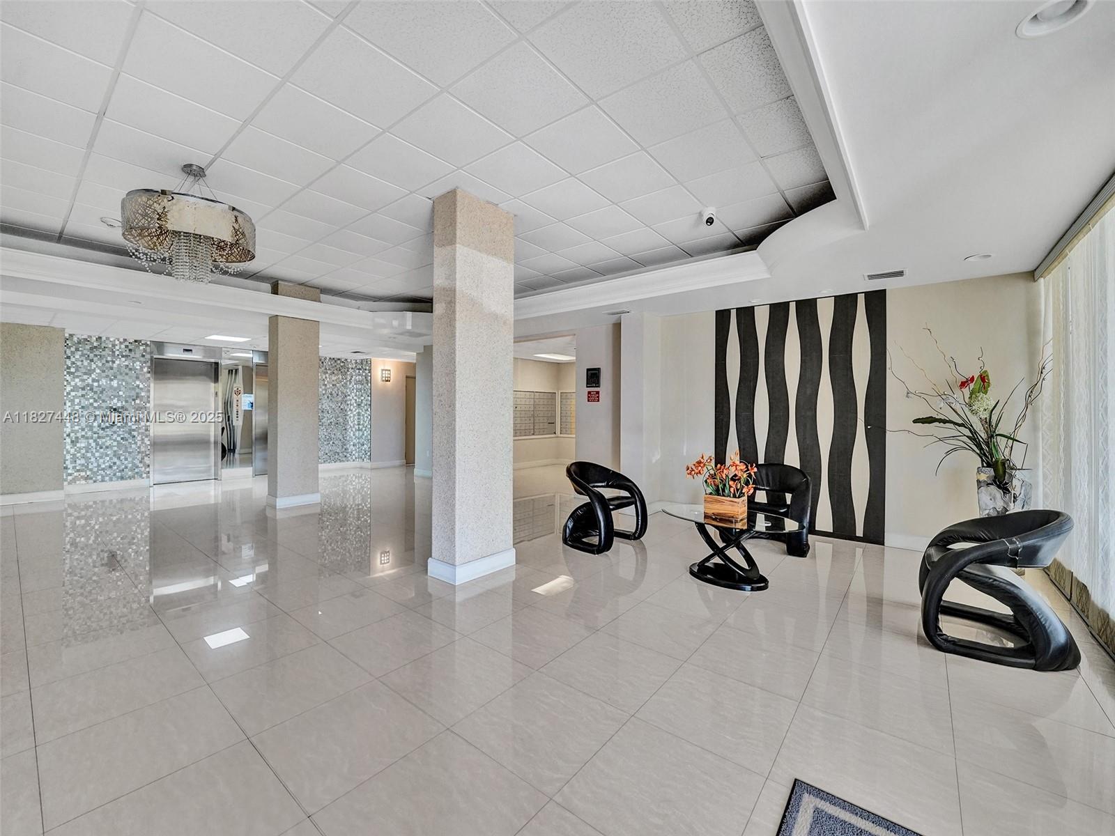 1833 South Ocean Drive, Unit 1702 Hallandale Beach, FL 33009 - Photo 57 of 80 a view of a lobby with furniture and floor to ceiling window