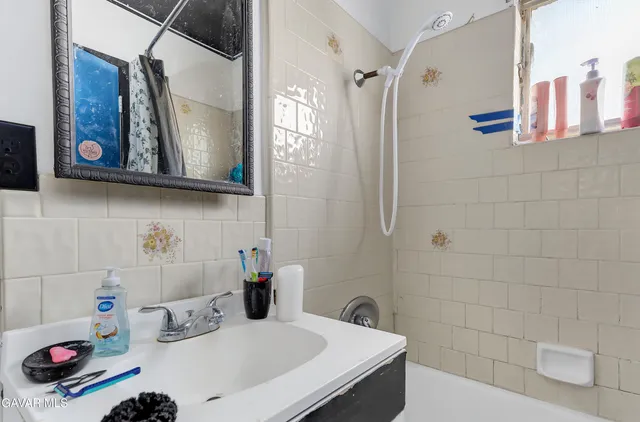 a bathroom with a sink and a mirror