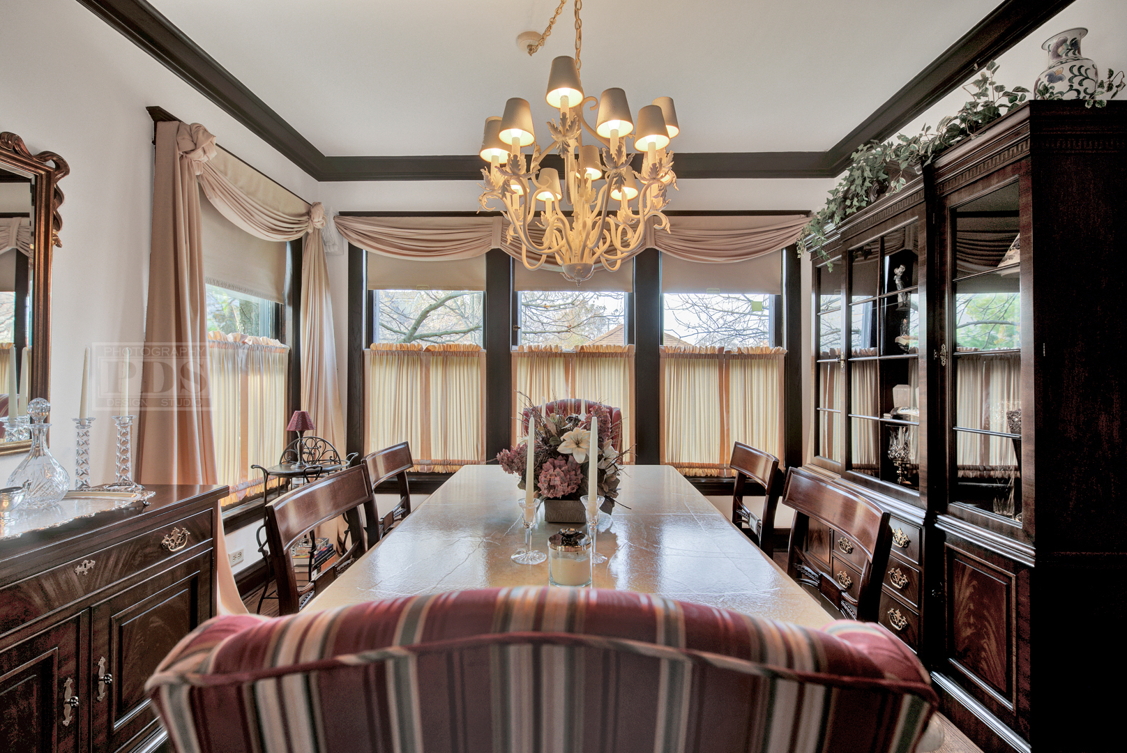 4512 Wolf Road Western Springs, IL 60558 - Photo 16 of 40 a view of a dining room with furniture a chandelier and large windows