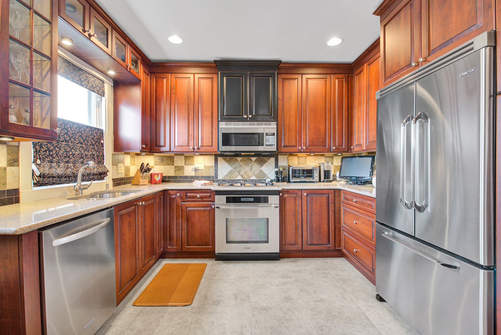 4512 Wolf Road Western Springs, IL 60558 - Photo 18 of 40 a kitchen with stainless steel appliances granite countertop a refrigerator and a sink