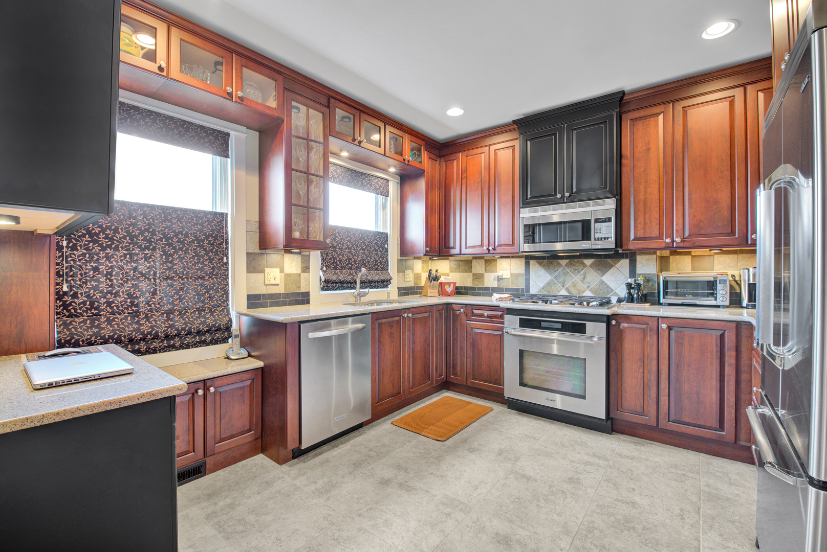 4512 Wolf Road Western Springs, IL 60558 - Photo 19 of 40 a kitchen with stainless steel appliances granite countertop a stove a sink dishwasher and a refrigerator