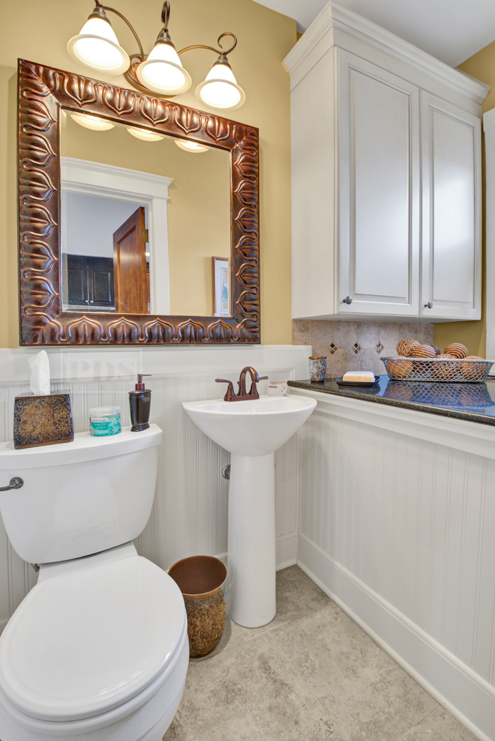 4512 Wolf Road Western Springs, IL 60558 - Photo 23 of 40 a bathroom with a toilet sink and mirror