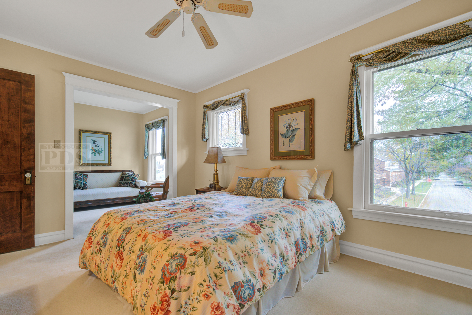 4512 Wolf Road Western Springs, IL 60558 - Photo 28 of 40 a bedroom with a large bed and a chandelier