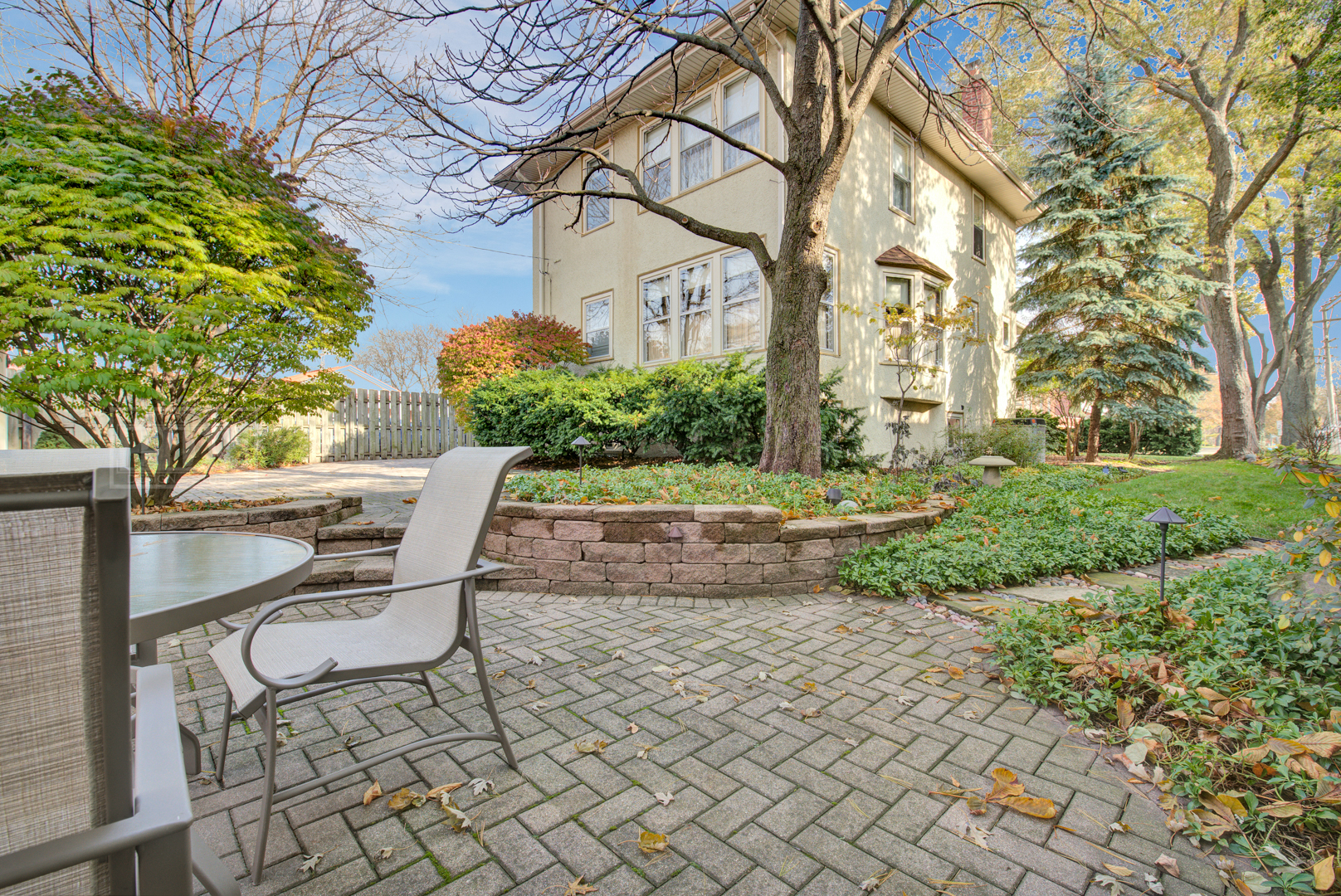 4512 Wolf Road Western Springs, IL 60558 - Photo 34 of 40 a view of a patio with table and chairs and potted plants