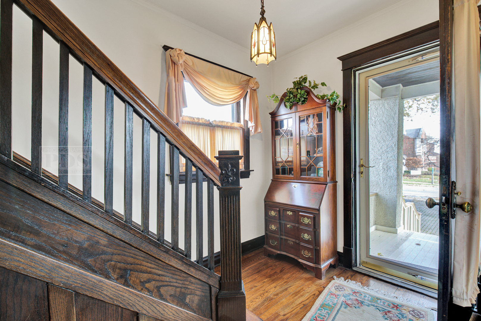 4512 Wolf Road Western Springs, IL 60558 - Photo 7 of 40 a view of a hallway with wooden floor and stairs