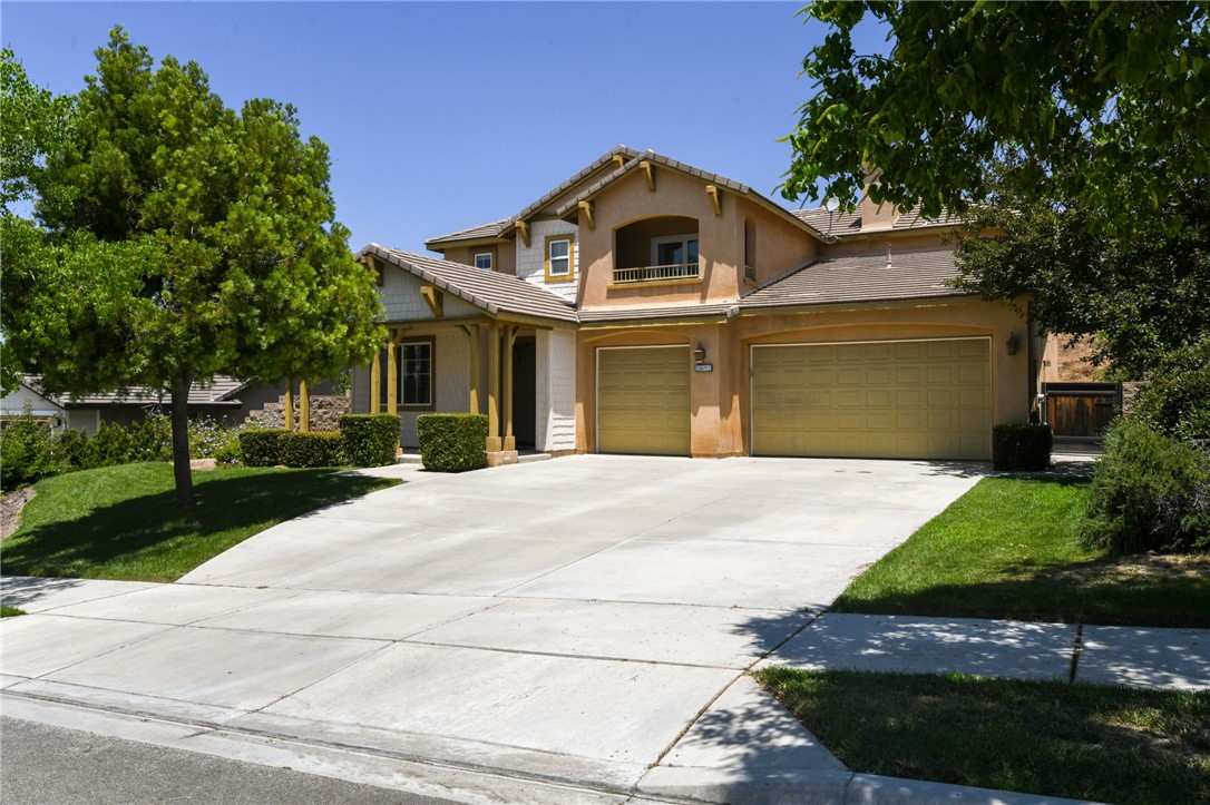 11692 Bluegrass Road Yucaipa, CA 92399 - Photo 1 of 1 a front view of a house with a yard