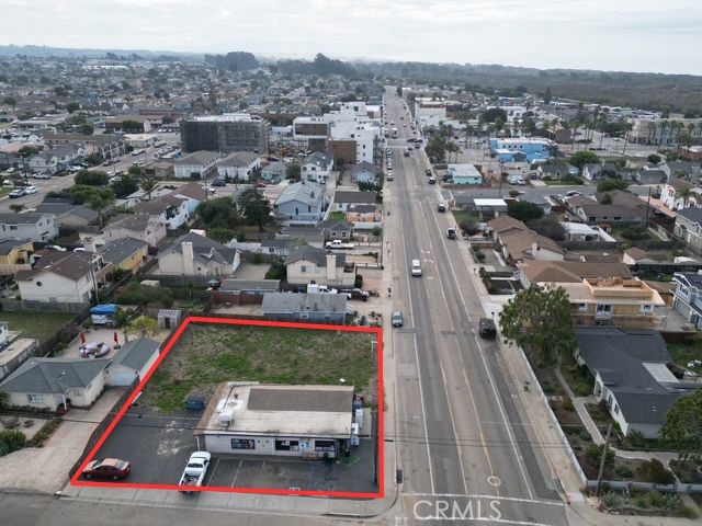 an aerial view of multiple houses with a city