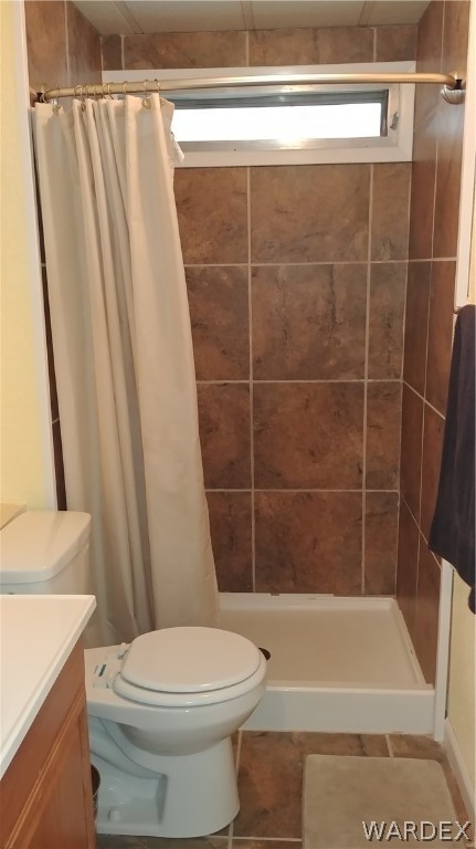 4057 Cavalry Road Fort Mohave, AZ 86426 - Photo 11 of 12 a bathroom with a shower a toilet and a sink