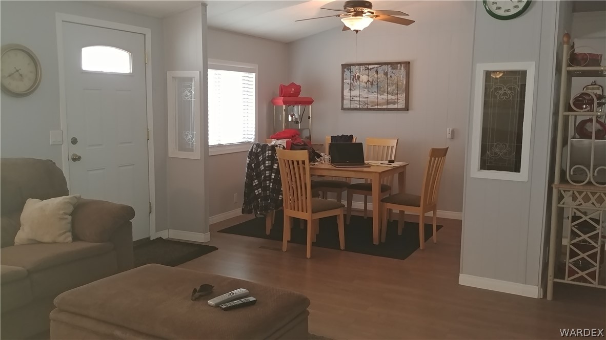 4057 Cavalry Road Fort Mohave, AZ 86426 - Photo 3 of 12 a view of a dining room with furniture and a chandelier